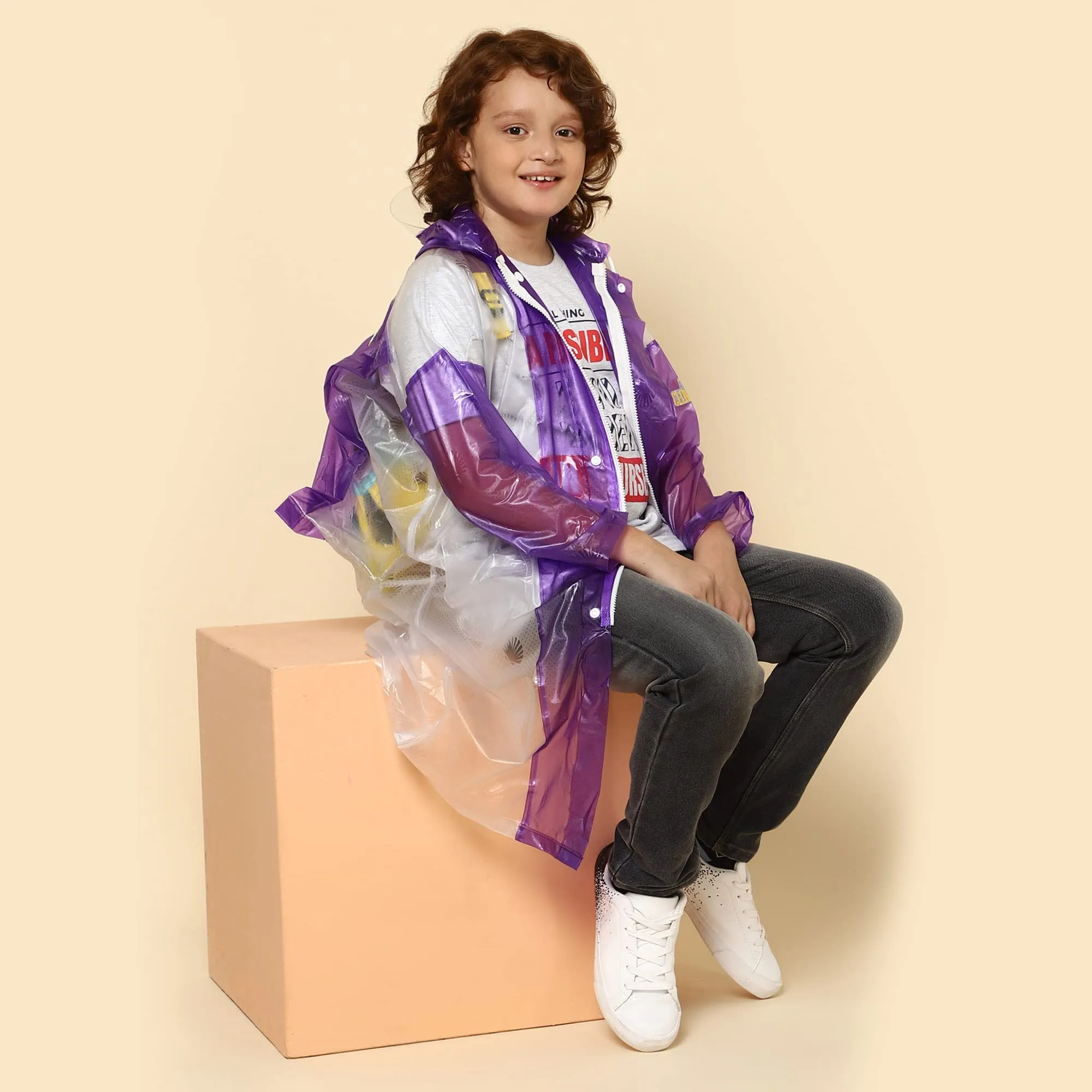 THE CLOWNFISH Simpson Series Kids Waterproof PVC Longcoat with Adjustable Hood & Extra Space for Backpack/Schoolbag Holding. Printed Plastic Pouch. Kid Age-9-10 years (Size-36-Purple)