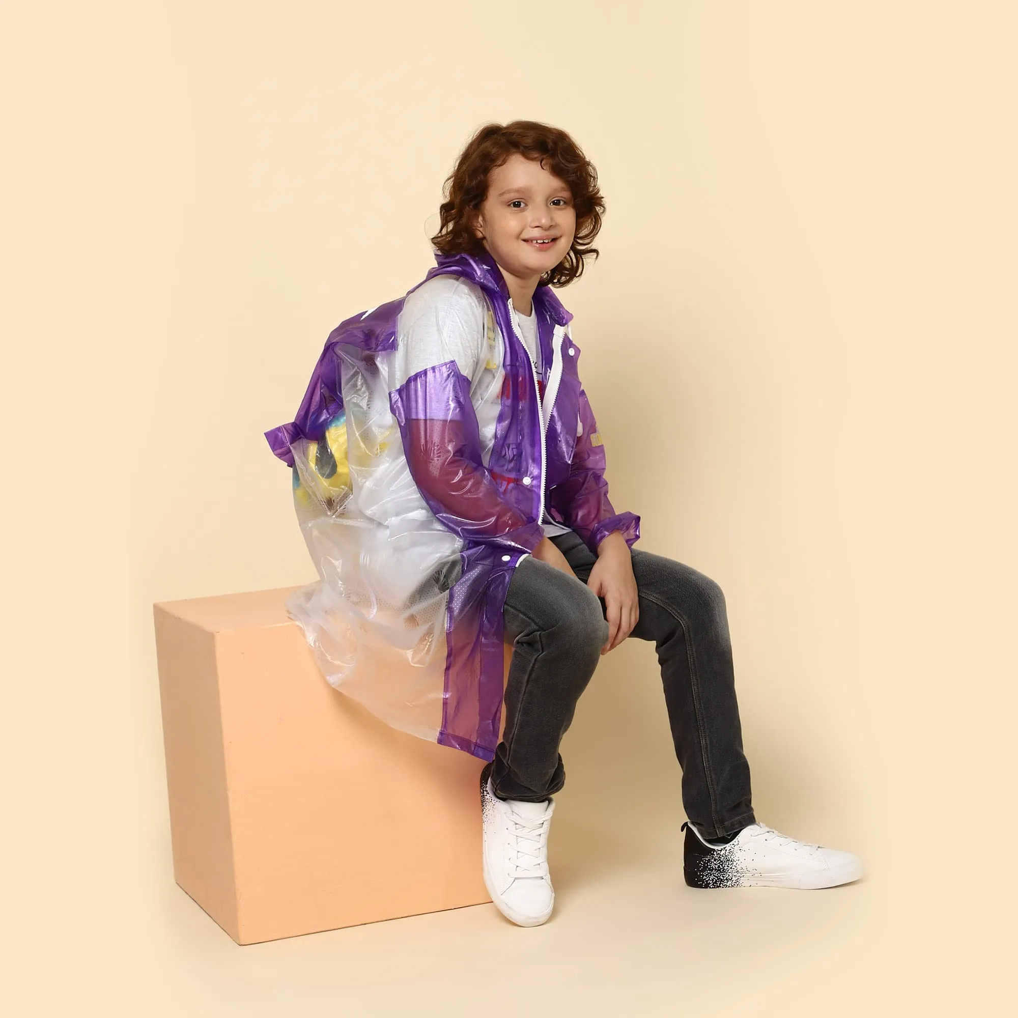 THE CLOWNFISH Simpson Series Kids Waterproof PVC Longcoat with Adjustable Hood & Extra Space for Backpack/Schoolbag Holding. Printed Plastic Pouch. Kid Age-9-10 years (Size-36-Purple)